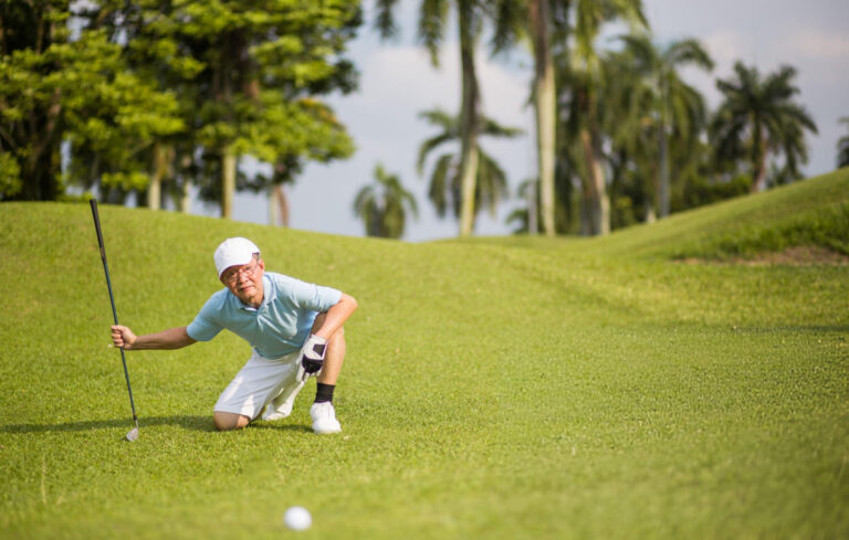 man playing golf on one knee