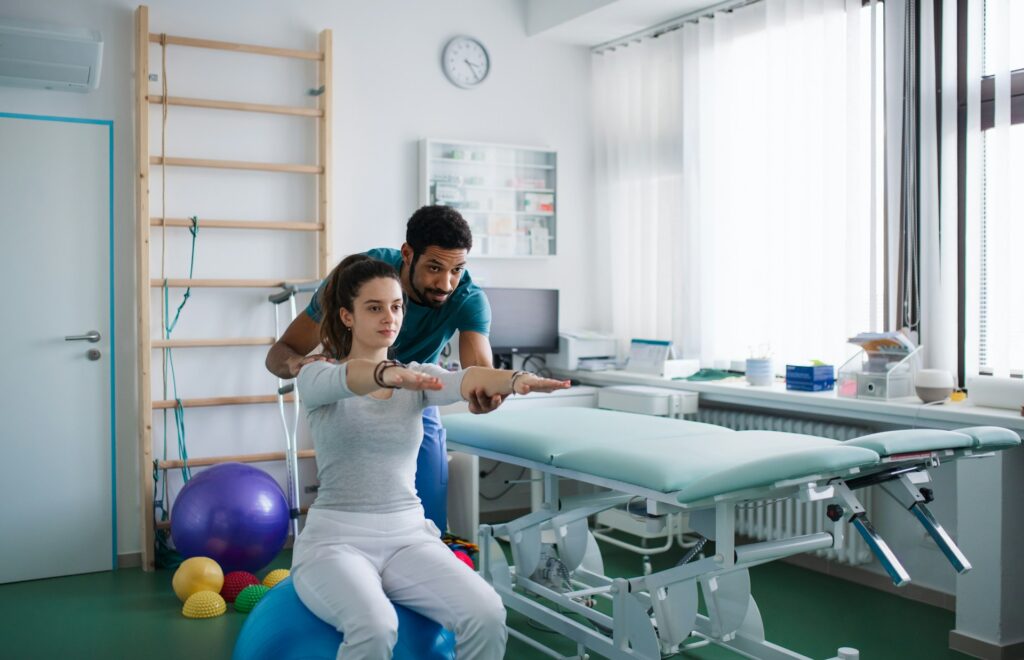 physical therapist and patient